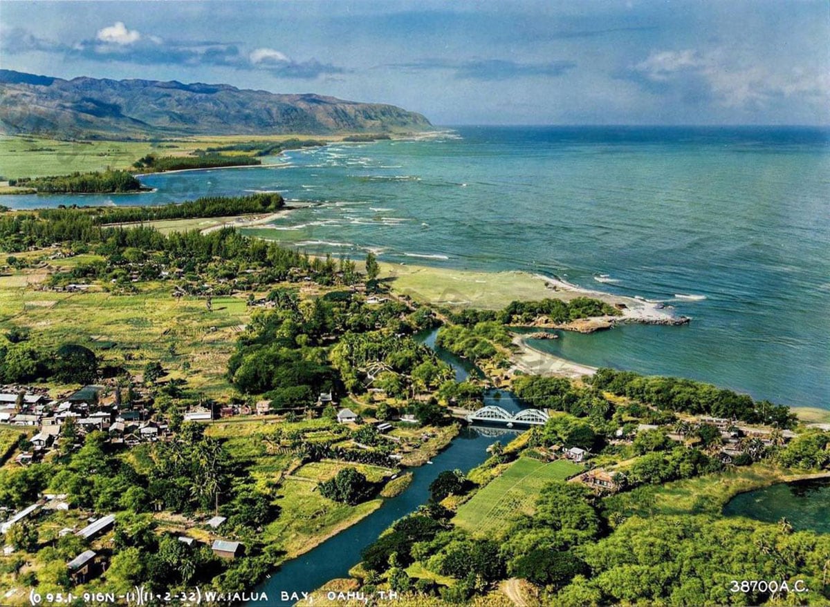 Colored aerial view of haleiwa town, rainbow bridge, harbor, Anahuku River, mountains and ocean on the north shore back in 1932