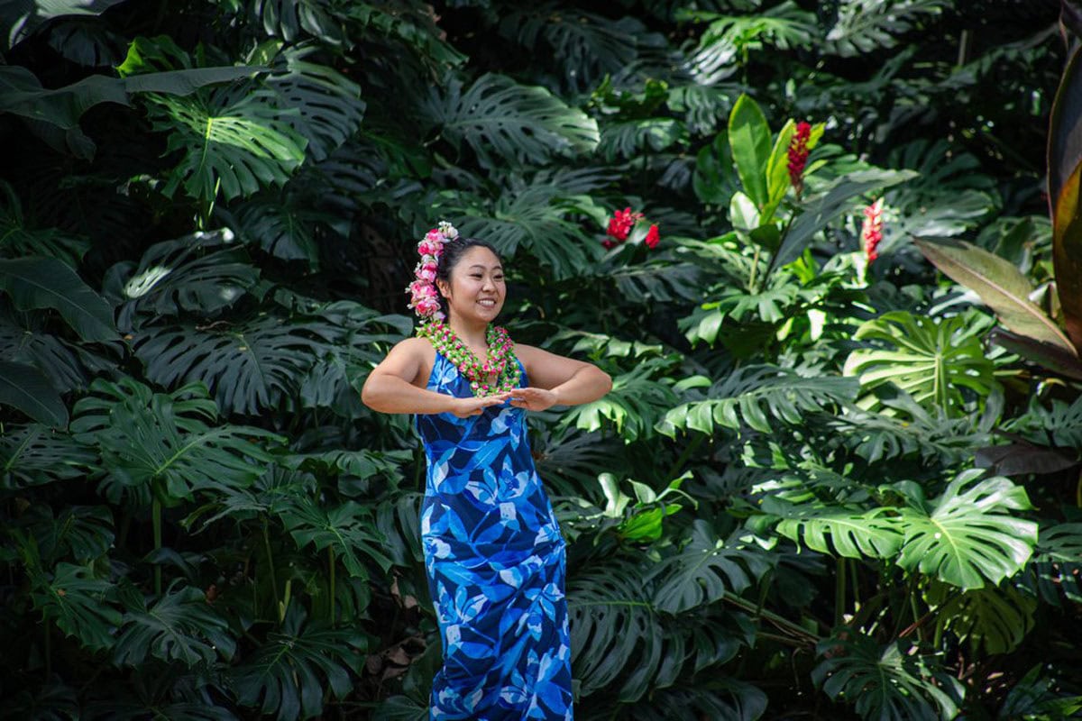 women dancing hula at the Waimea botanical gardens
