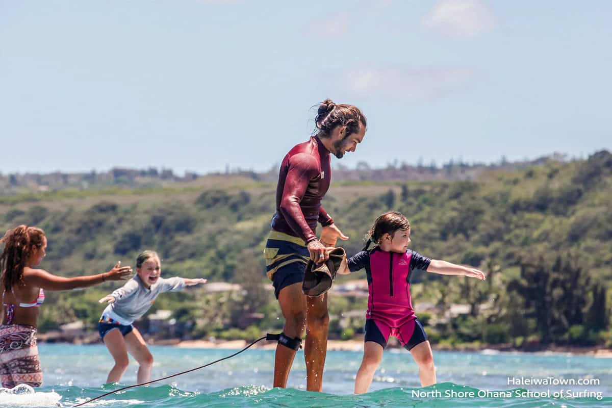 Instructors teaching kids to surf at Chuns Reef