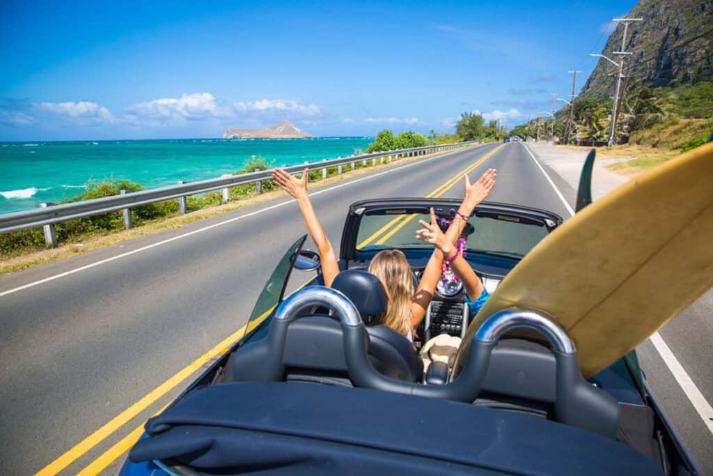 Driving along the coastline of Oahu during a self-guided audio driving tour